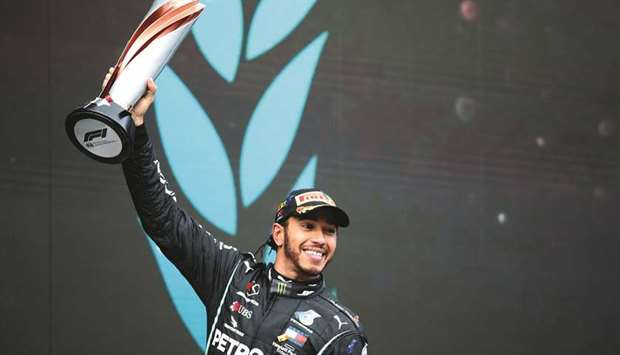 Mercedesu2019 Lewis Hamilton celebrates on the podium after winning the Turkish Grand Prix and the world championship yesterday.
