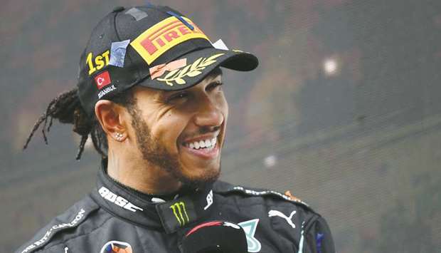 Mercedesu2019 British driver Lewis Hamilton gives an interview after winning the Turkish Formula One Grand Prix at the Intercity Istanbul Park circuit in Istanbul on Sunday. (AFP)