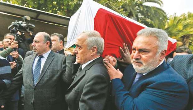 Syrian mourners, including assistant foreign minister Ayman Sousan (centre) carry the coffin of late Syrian Foreign Minister Walid Muallem before laying him to rest at a cemetery in the capital Damascus, yesterday.