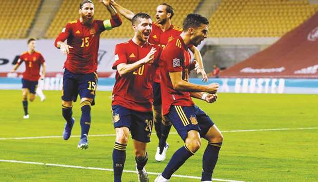 Spainu2019s Ferran Torres (right) celebrates after scoring against Germany in the UEFA Nations League match in Seville, Spain. (Reuters)