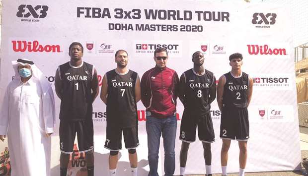 Team Lusail players Mame Souleye Ndour (left), Kostas Vasileiadis (second from left), Ousseynou Mbow (second from right) and Hamza Maher Radi (right) pose with head coach Mohamed Salim Abdulla (centre) ahead of the FIBA 3x3 World Tour Doha Masters.