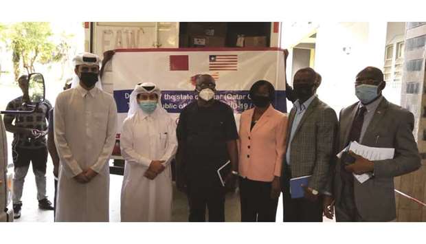 Qatari and Liberian officials attend the delivery event.
