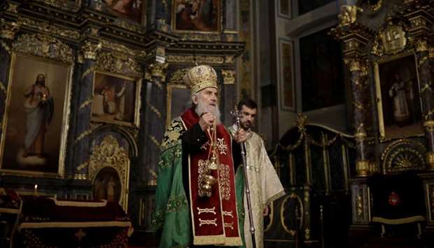 Serbian Patriarch Irinej conducts the Orthodox Easter service in the Saborna church in central Belgrade Serbia, April 8, 2018. REUTERS