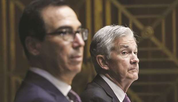 The disagreement between the two top officials erupted late on Thursday when outgoing Treasury Secretary Steven Mnuchin (left) released a letter to Federal Reserve chair Jerome Powell, demanding the return of money the government provides the central bank so it can lend to certain markets in times of stress.