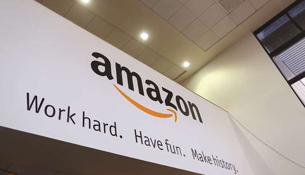 A sign hangs in the reception at the Amazon.com fulfilment centre in Hemel Hempstead, UK. The US retail giant has seen sales soar globally as restrictions to prevent the spread of the coronavirus sent consumers online, making it difficult for some bricks-and-mortar shops to compete.