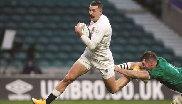 Englandu2019s Jonny May runs through to score their second try against Ireland in their Autumn Nations Cup match at Twickenham Stadium in London yesterday. (Reuters)