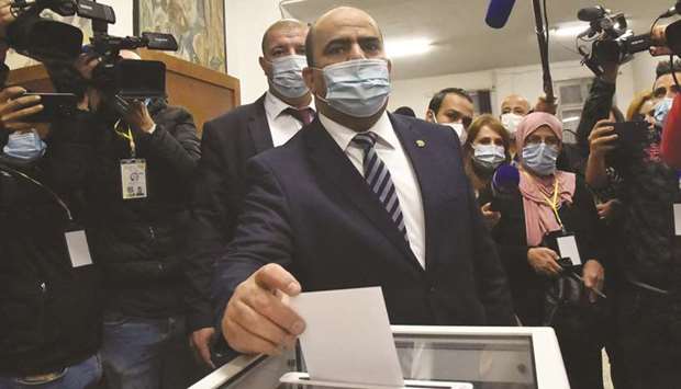 Slimane Chenine, president of Algeriau2019s National Peopleu2019s Congress (APN), casts his ballot at a polling station in the capital Algiers during a vote for a revised constitution, yesterday.
