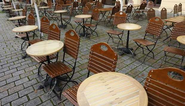 Tables and chairs are seen outside a closed cafe at Berlin's Hackescher Markt amid the novel coronavirus pandemic.