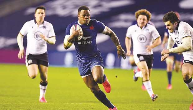 Franceu2019s centre Virimi Vakatawa runs to score the opening try during the Pool B Autumn Nations Cup international match against Scotland at Murrayfield Stadium in Edinburgh. (AFP)