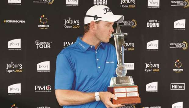 Denmarku2019s Joachim Hansen with trophy after winning the Joburg Open at the Randpark Golf Club in Johannesburg yesterday.