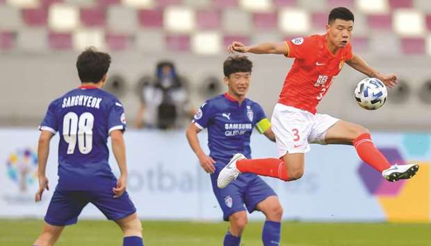 Guangzhou Evergrandeu2019s Mei Fang (right) in action during the AFC Champions League match against Suwon Samsung Bluewings at Khalifa International Stadium yesterday. PICTURE: Noushad Thekkayil