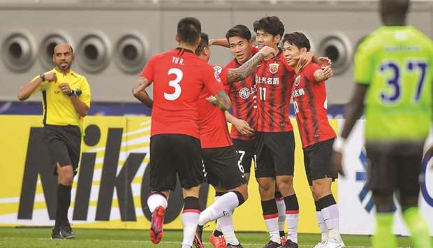 Lyu Wenjun (second from right) of Shanghai SIPG celebrates his goal during the AFC Champions League Group H match against Jeonbuk Hyundai Motors yesterday. PICTURE: Noushad Thekkayil