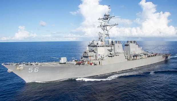 USS John S. McCain had immediately returned to neutral waters after being warned off, the Russian defence ministry said.