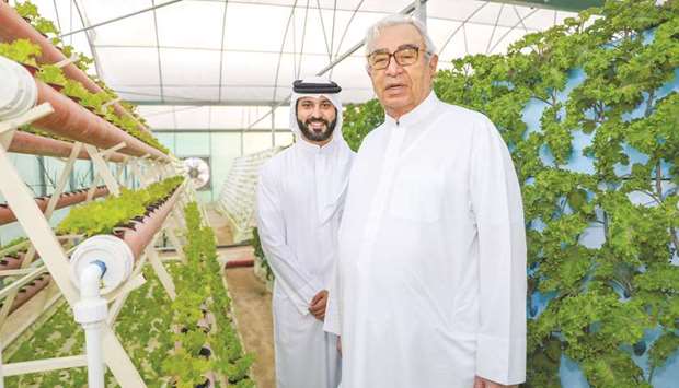 Hussain Ibrahim Alfardan with his grandson, Fardan Fahad Alfardan, at Safwau2019s hydroponics farm.