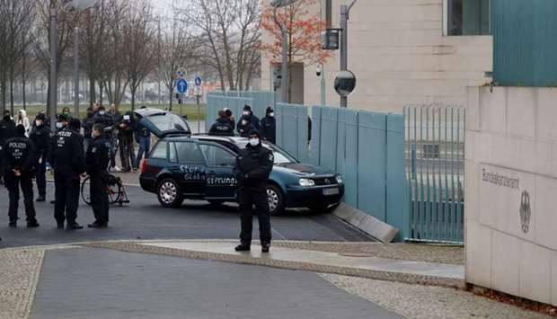 Police secures the area after a man crashed with his car into the gate of the main entrance of the chancellery in Berlin, the office of German Chancellor Angela Merkel in Berlin
