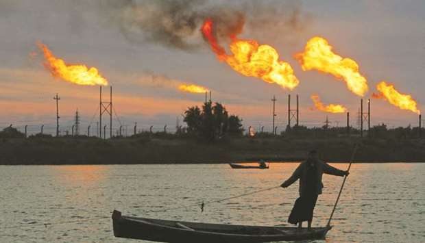 Flames emerge from flare stacks at the oil fields in Basra (file)