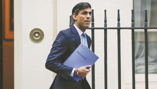 Rishi Sunak, UK chancellor of the exchequer, departs Downing Street ahead of the presentation of spending plans at Parliament, in London, yesterday.