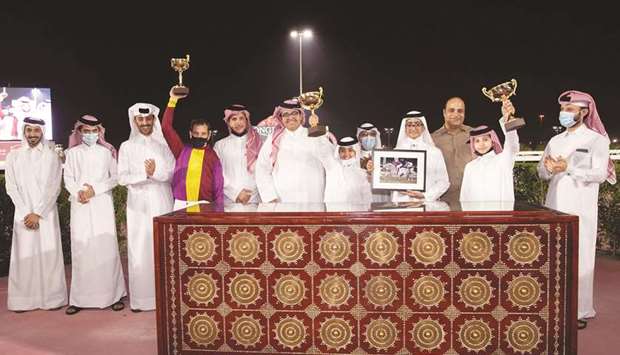 Winners of Al Huwaila Cup pose with their trophies after Zakhir Racingu2019s Daneyan won the 1900m feature at Qatar Racing and Equestrian Clubu2019s Al Rayyan Park yesterday. PICTURES: Juhaim