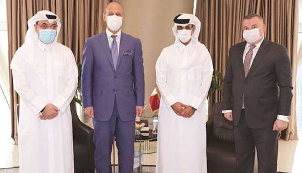 Sheikh Hamad bin Khalifa bin Ahmed al-Thani (second from right), President of the Qatar Football Association, with Adnan Dirjal, the Iraqi Minister of Youth and Sports.