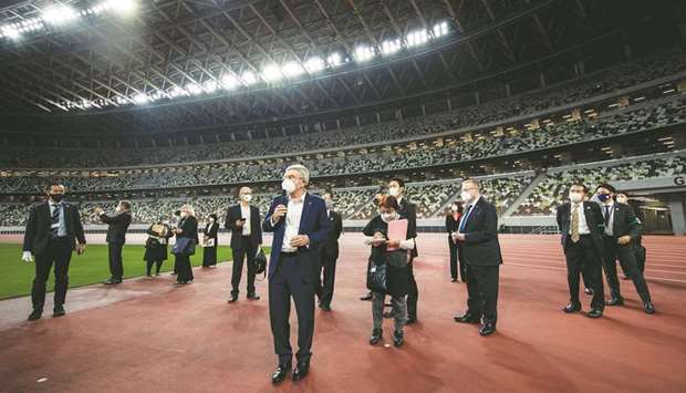 International Olympic Committee president Thomas Bach speaks to the media as he visits the National Stadium, the main venue for the 2020 Olympic and Paralympic Games, in Tokyo, Japan, on November 17, 2020. (Reuters)