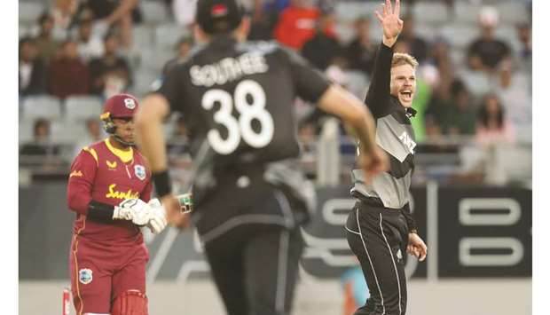 New Zealandu2019s Lockie Ferguson (right) takes the wicket of West Indiesu2019 Shimron Hetmyer (left) during the Twenty20 match at Eden Park in Auckland, New Zealand, yesterday. (AFP)