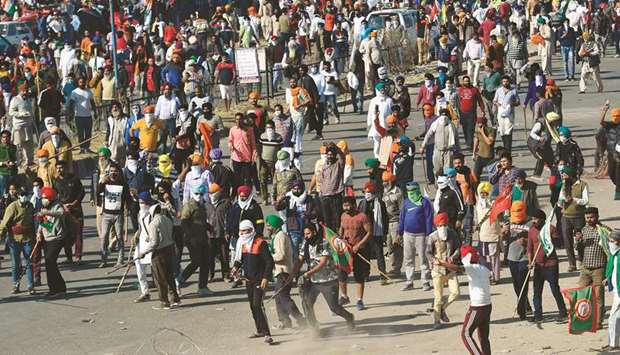 Farmers gather as they try to march to New Delhi to protest against the central governmentu2019s recent agricultural reforms at the Delhi-Haryana border in Kundli yesterday.