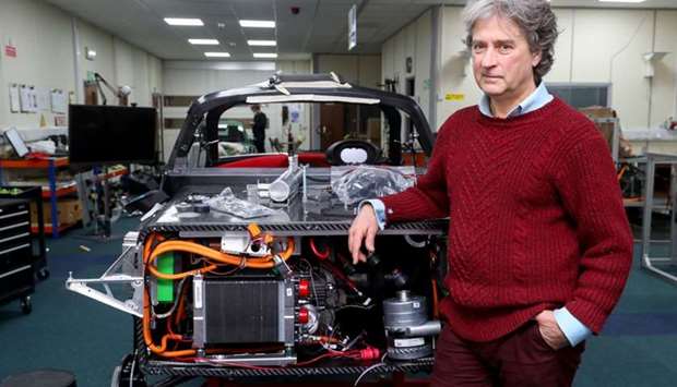 Hugo Spowers, chief engineer and founder of Riversimple, poses for a photograph with one of his company's hydrogen powered 'Rasa' cars in at his factory in Llandrindod Wells in central Wales on November 23