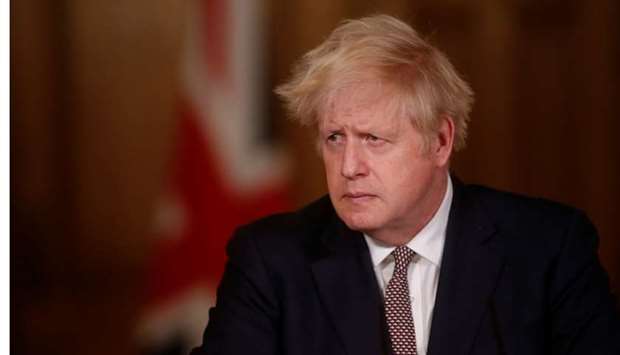Britain's Prime Minister Boris Johnson attends a news conference on the ongoing situation with the coronavirus disease, at Downing Street, in London, Britain on November 26