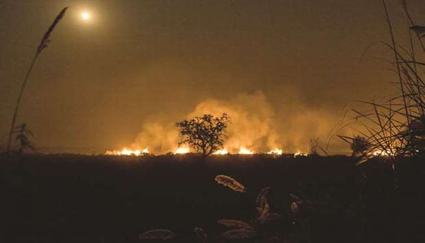 Crop stubble is set ablaze on farmland in Uttar Pradesh, filling the sky near Indiau2019s capital New Delhi with smoke (file). After years of pressure from mostly European investors, Asian companies are pulling ahead of their North American counterparts when it comes to climate risk reporting.