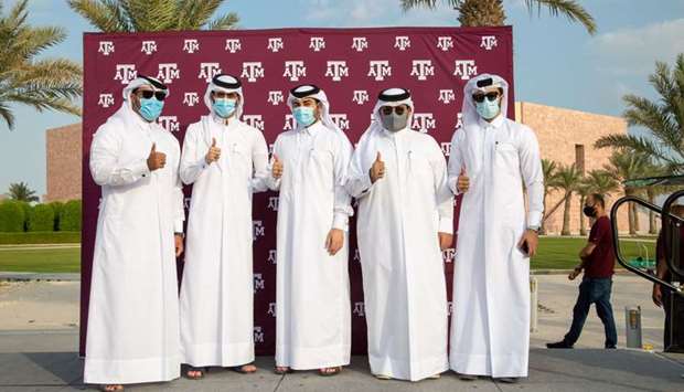 Five Tamuq graduates after receiving their Aggie rings
