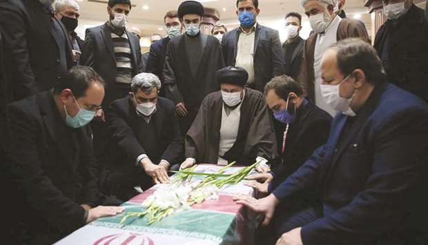 Mourners gather around the coffin of Iranian nuclear scientist Mohsen Fakhrizadeh at the Imam Khomeiniu2019s Shrine in Tehran, yesterday.