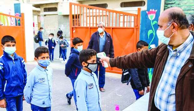 School officials hold temperature checks in Gaza schools