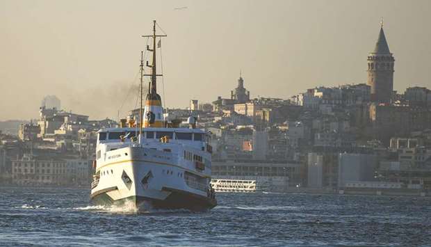 A ferry boat sails on the Bosphorus Strait to the Asia side in Istanbul with the Galata Tower seen in the background on November 27. Turkeyu2019s economy roared to a more-than-expected 6.7% growth rate in the third quarter, as a flood of credit helped it rebound from a 10% contraction in the previous period when lockdowns were imposed to curb the initial coronavirus wave.