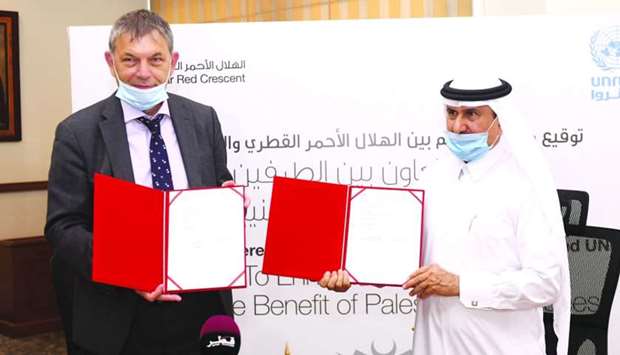 Philippe Lazzarini and Ali bin Hassan al-Hammadi at the MoU signing Tuesday. PICTURE: Shemeer Rasheed.