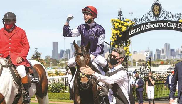Jockey Jye McNeil returns to scale after riding Twilight Payment to victory in race 7 during Melbourne Cup Day at Flemington Racecourse in Melbourne, Australia, yesterday. (Reuters)