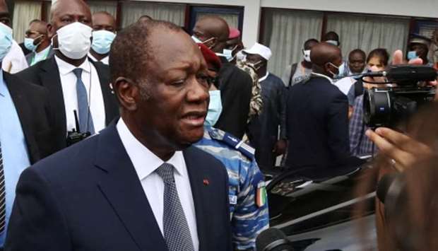 Alassane Ouattara speaks to the media