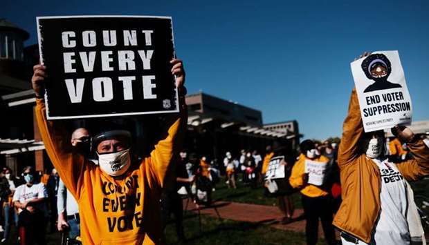 People participate in a protest in support of counting all votes as the election in Pennsylvania is still unresolved in Philadelphia, Pennsylvania