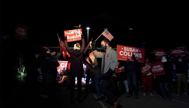 Supporters of US Senator Susan Collins (R-ME) dance outside her election night headquarters at the Hilton Garden Inn in Bangor, Maine