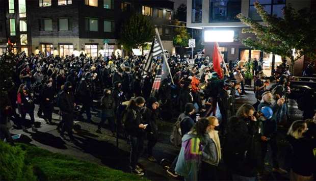 Black Lives Matter protesters march through the streets of Southeast Portland, Oregon