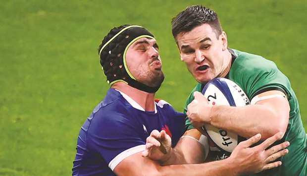 Irelandu2019s fly-half Johnny Sexton (right) is tackled by Franceu2019s Gregory Alldritt during the Six Nations match at the stade de France in Paris on October 31, 2020. (AFP)