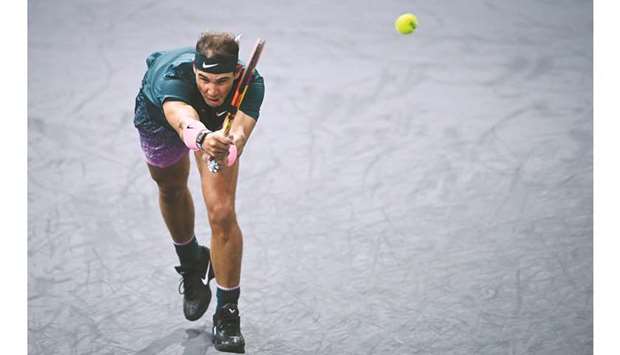 Spainu2019s Rafael Nadal returns the ball to Australiau2019s Jordan Thompson  during their Paris Masters match at The AccorHotels Arena in Paris yesterday. (AFP)