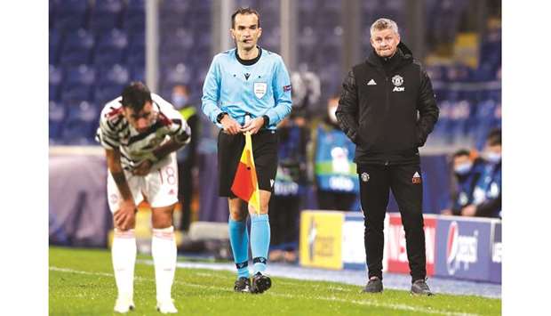 Manchester United manager Ole Gunnar Solskjaer (right) and midfielder Bruno Fernandes (left) look dejected after they slumped to 1-2 defeat against Istanbul Basaksehir in the Champions League in Istanbul on Wednesday. (Reuters)