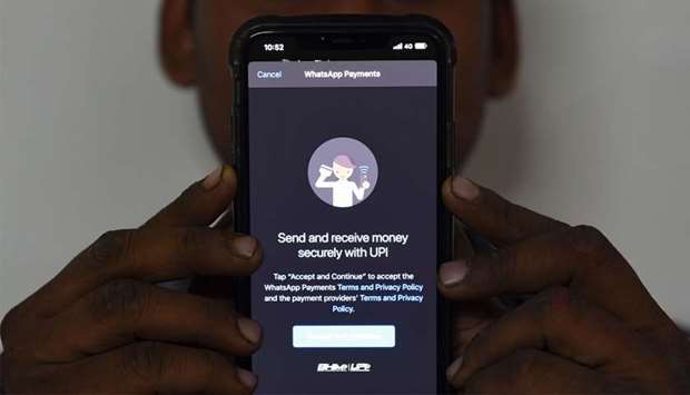 A user displays the Facebook's WhatsApp application payment feature on his mobile phone