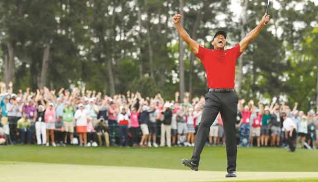 Tiger Woods reacts after winning the Masters last year, his first major in 11 years.
