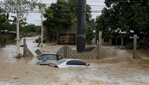 Submerged cars are pictured at an area affected by floods after the passage of Storm Eta, in El Progreso