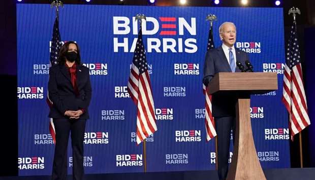 Democratic presidential nominee Joe Biden speaks about election results next to vice presidential nominee Kamala Harris in Wilmington, Delaware.