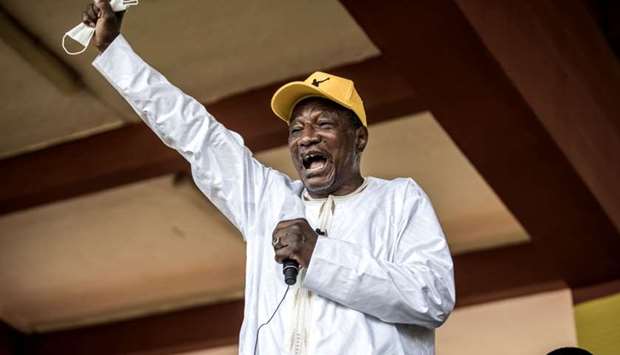 Alpha Conde addressing his supporters at a campaign rally in Conakry on October 16.
