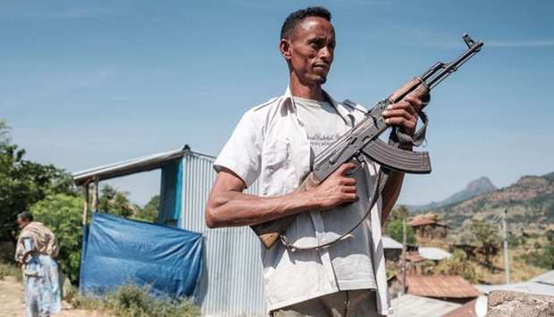 An Ethiopia's Amhara Region militia man poses in the town of Musebamb, 44 kms northwest from Gondar as Ethiopian lawmakers vote to replace the current government of the nearby federal state of Tigray, after the army launched air strikes to destroy military assets in the region in a worsening internal conflict