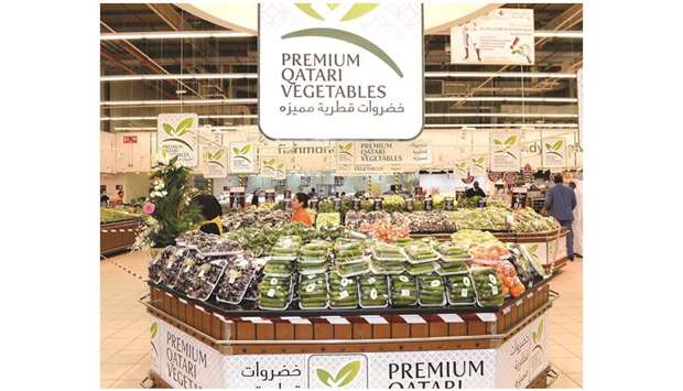 A display of Premium Qatari vegetables at a hypermarket.
