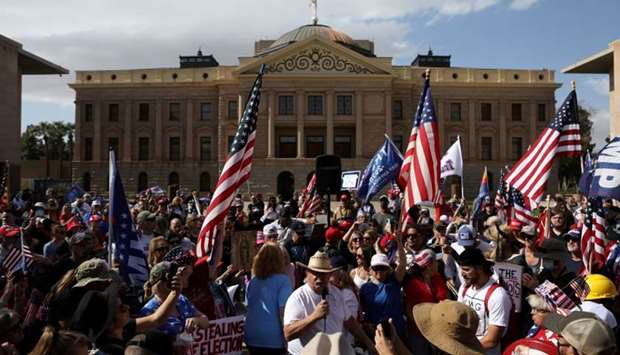 Supporters of US President Donald Trump gather at a ,Stop the Steal, protest after the 2020 US presidential election was called for Democratic candidate Joe Biden, in front of the Arizona State Capitol in Phoenix, Arizona.